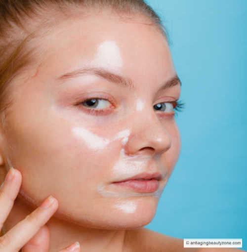 Woman using a gel facial mask.